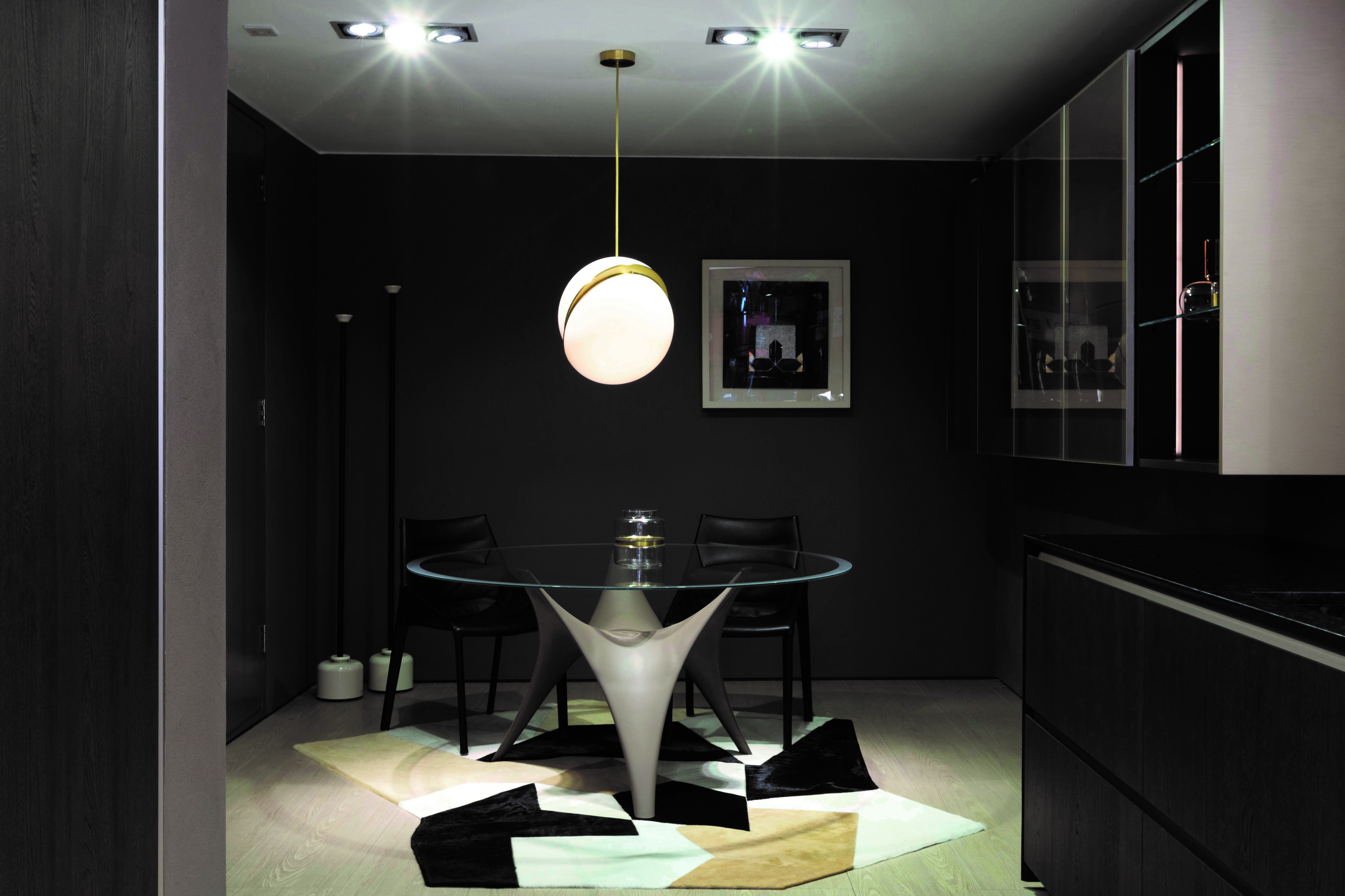 Black room with glass round table 